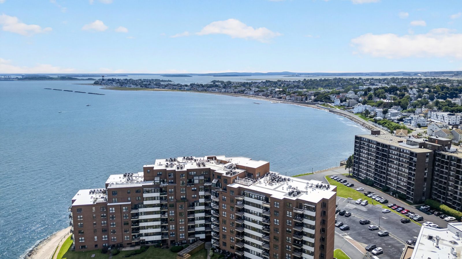 Aerial photo of a waterfront condo building, Winthrop MA